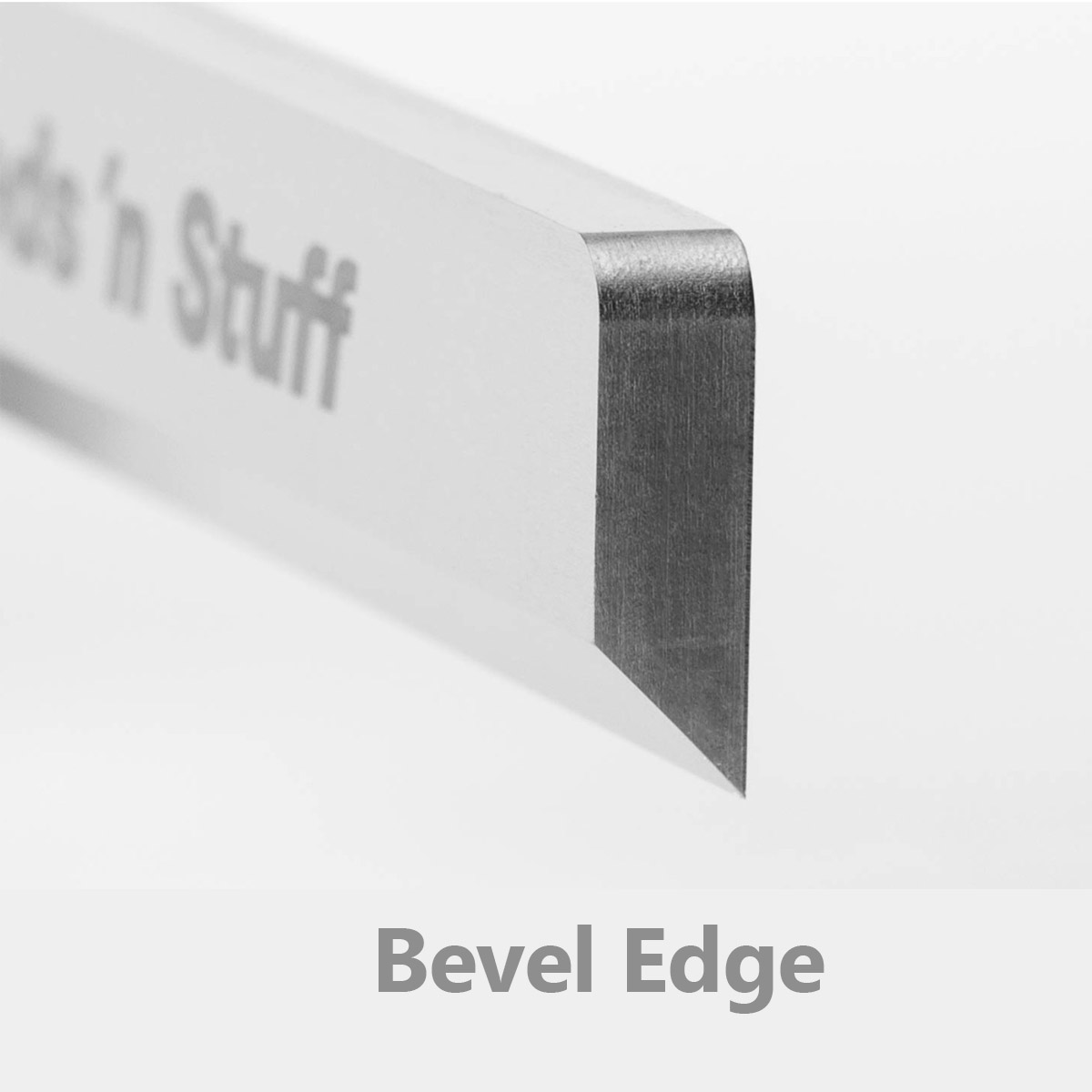 Image of closup of knife edge showing bevel on white background for reed makers