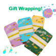 gift wrapped packages with sweet reeds gift wrapping paper with text and graffiti splashes on white background