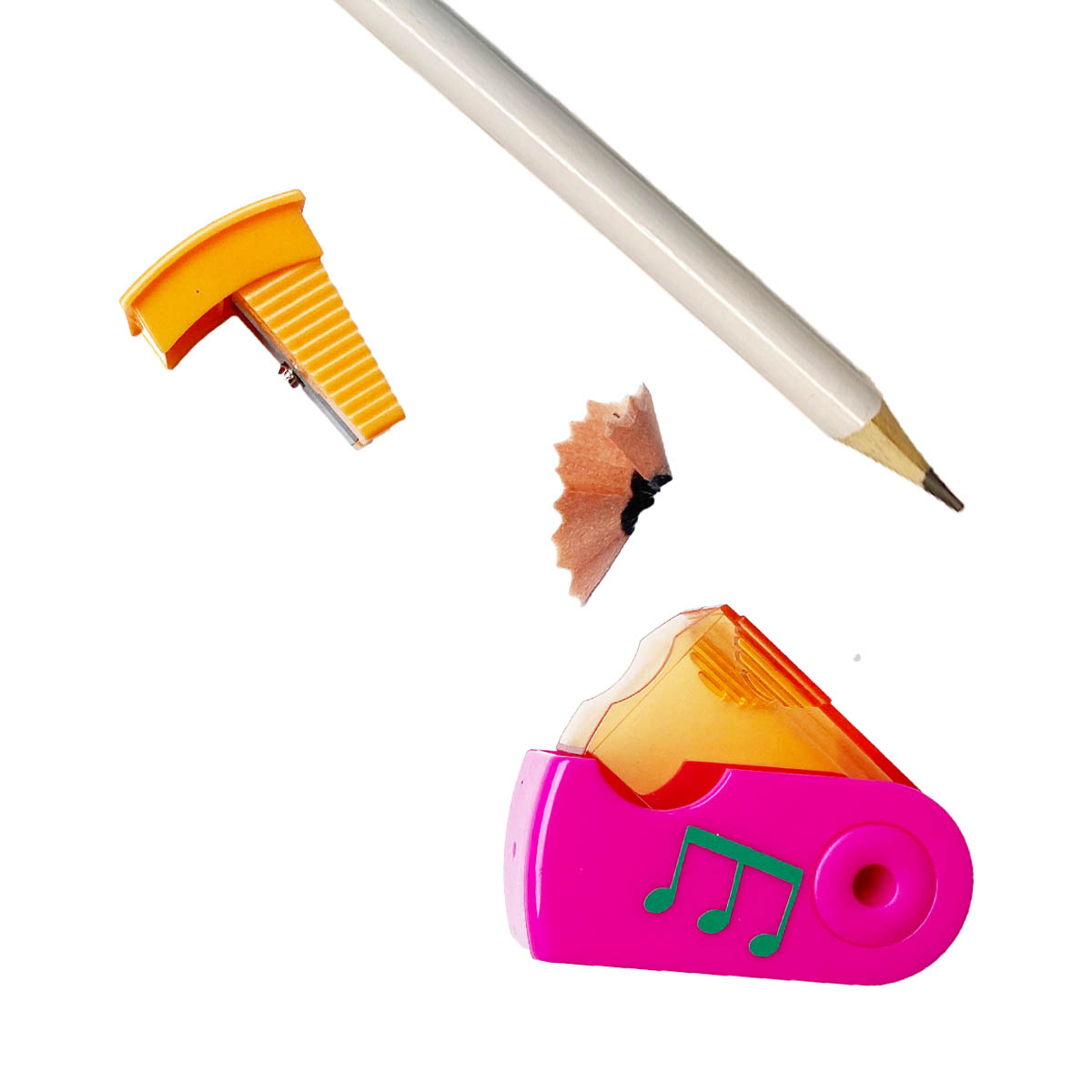 pink and orange music themed pencil sharpener open showing how to release the shavings